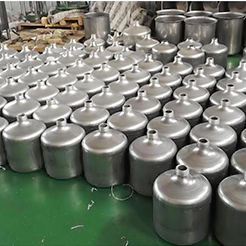 Batch metal spinning production of chemical barrels